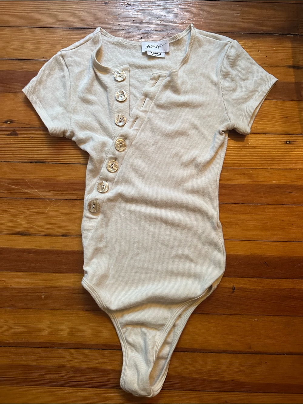 The line by K button bodysuit